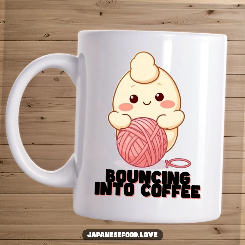 Funny mug showing a smiling dumpling character happily bouncing a colorful yarn ball, radiating warmth and playfulness.