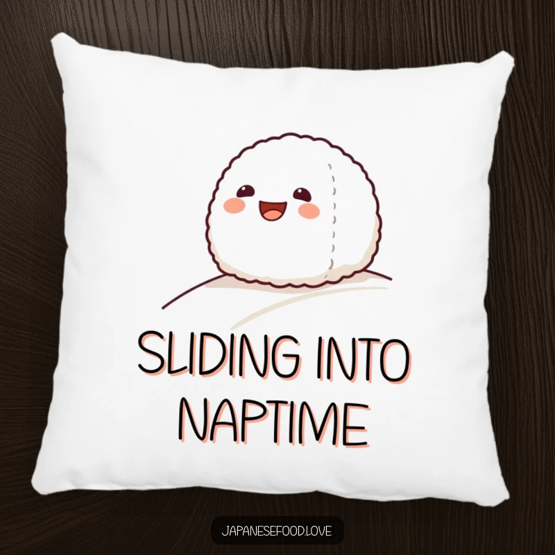 Funny pillow featuring a grinning onigiri rice ball character sliding down a gentle slope, soft and amusing.