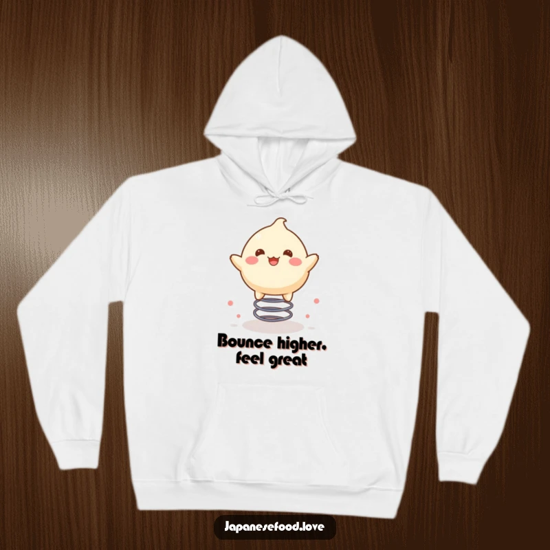 Funny hoodie showcasing a delighted mochi character happily bouncing high on a spring, exuding pure joy.