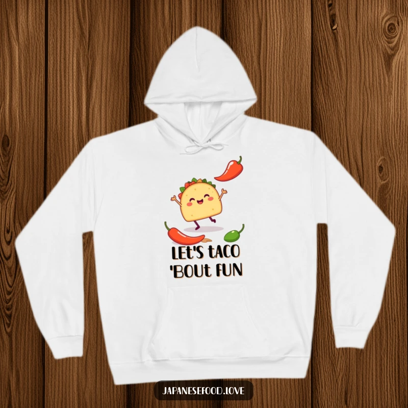 Funny hoodie showing a happy taco with tiny legs doing a silly jig near a chili pepper, offering warmth and festive humor.