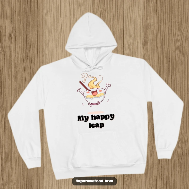 Comfortable hoodie displaying an excited ramen bowl with swirling steam in a joyful leaping pose.