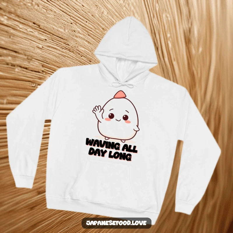 Funny hoodie showcasing a smiling onigiri character wearing a tiny hat and waving with great enthusiasm.