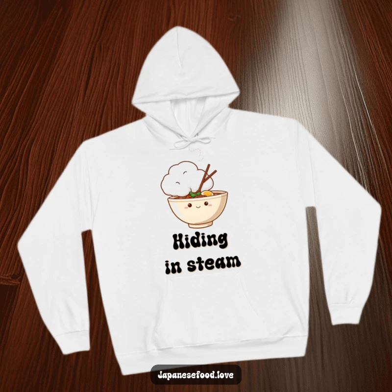 Funny hoodie displaying a shy ramen bowl character peeking from behind a large, steaming cloud, perfect for cozy, humorous wear.