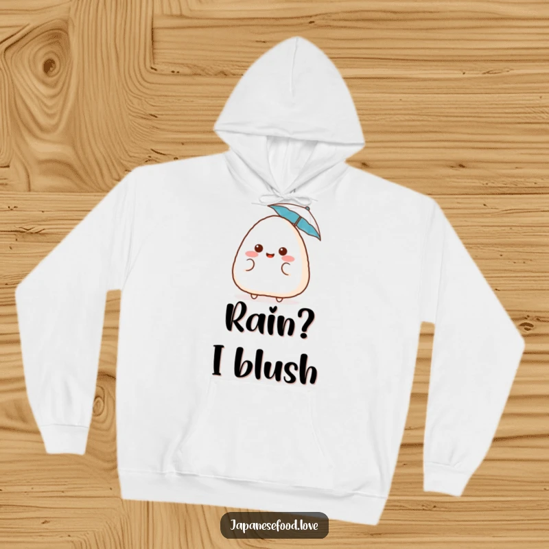 Funny surprised onigiri hoodie, featuring a blushing rice ball with a tiny umbrella, offering cute comfort and humor, a wonderful funny gift.