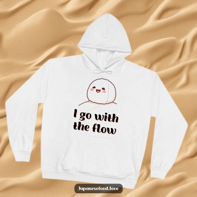 Funny hoodie featuring a grinning onigiri rice ball character in motion, sliding down a gentle slope with joy.