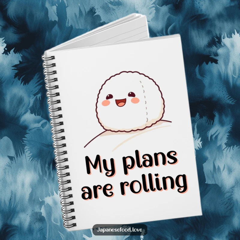 Funny notebook cover featuring a grinning onigiri rice ball sliding down a gentle slope, ideal for jotting thoughts.