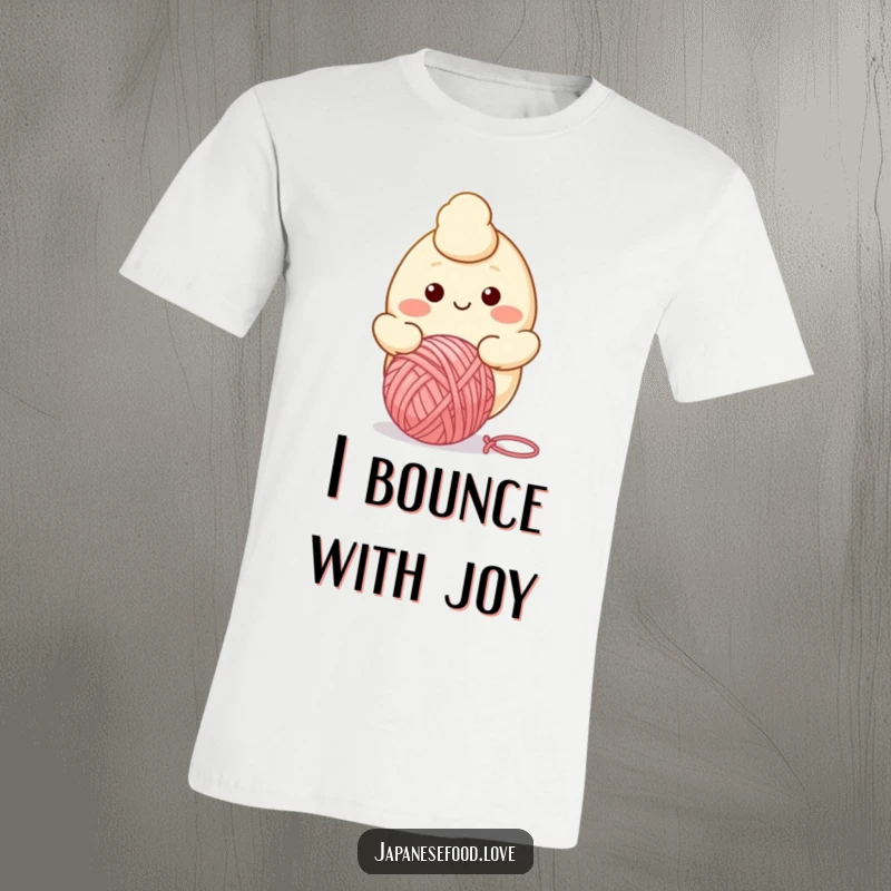 Funny t-shirt graphic of a smiling dumpling character enthusiastically bouncing a ball of yarn, full of cheerful energy.