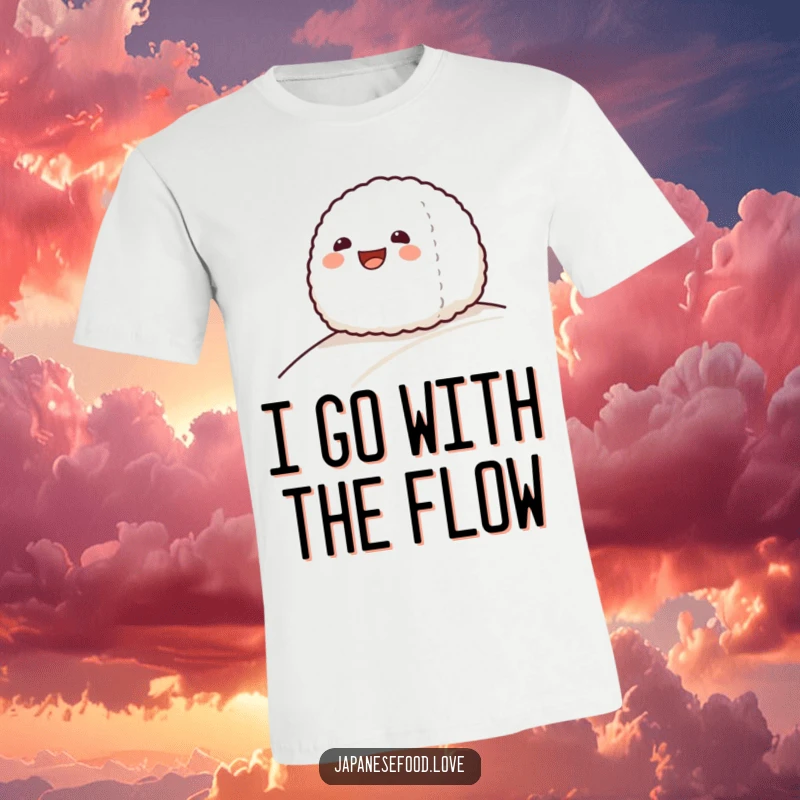 Funny t-shirt with a grinning onigiri rice ball character comically sliding down a gentle slope, full of zest.