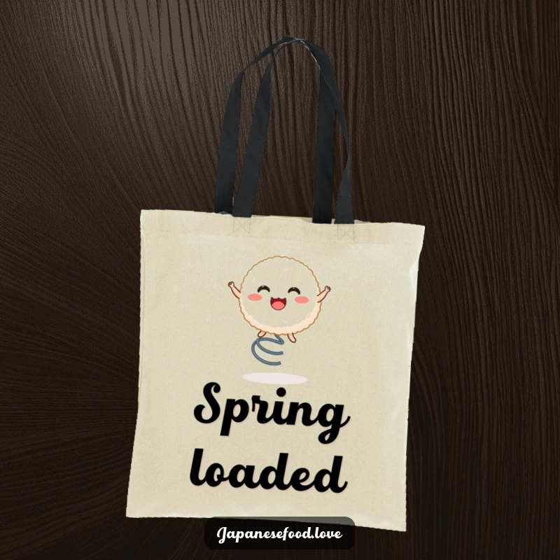 Funny tote bag with a beaming rice ball character joyfully bouncing on a spring, ideal for carrying groceries with humor.